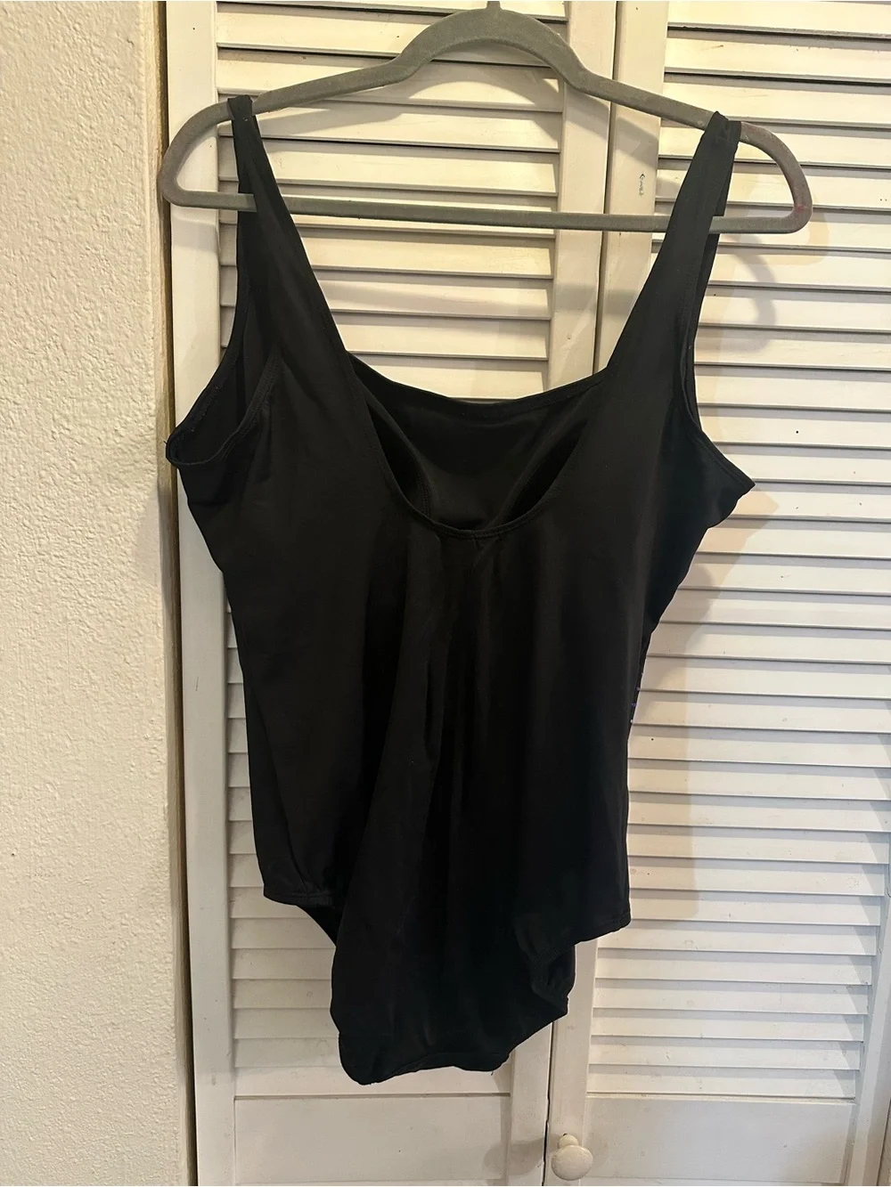 Black One-Piece Swimsuit with Blue Sequin Accent